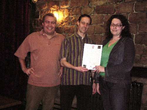 Winner of the treasure-hunt Sharon Laird receives her prize (in the form of a voucher) from branch chairman Cliff Laine, watched by Matt Jackson
